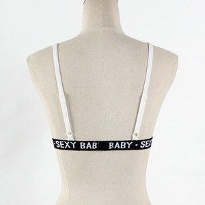 Detail of white sports bra with sexy baby printed elastic back strap and slim shoulder straps