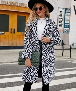 Detail of a luxury faux fur coat with zebra stripes pattern and a notched lapel design