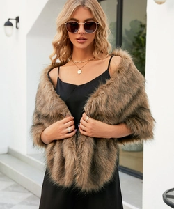 Detail shot of a brown faux fur capelet over a black satin dress for elegant evening wear
