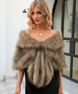 Detail of soft faux fox fur shawl in tan gradient with thick plush texture and luxury feel