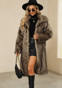 Detail shot of the thick faux fur texture and long pile of the winter brown coat
