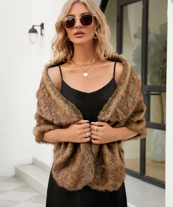 Close-up of soft brown faux fur shawl texture with luxurious glossy finish and thick pile