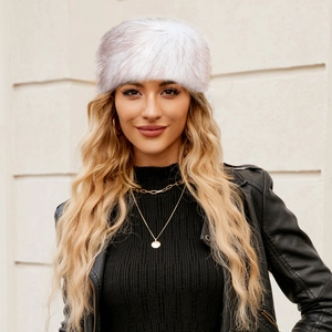 Faux fur winter headband in white showing plush texture and stylish outdoor outfit look