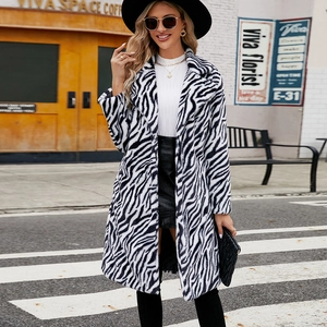 Women's faux fur coat featuring bold zebra print, longline cut and classic lapel collar