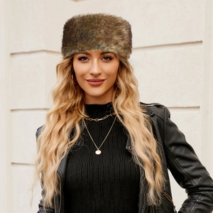 Close-up of fluffy tan faux fur headband with soft texture and warm winter style