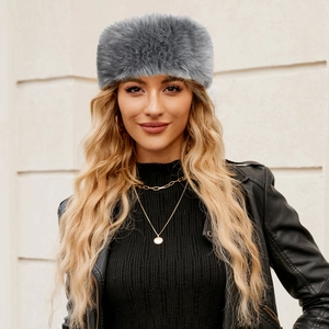 Detail shot of a grey faux fur headband for women, thick and warm winter hair accessory
