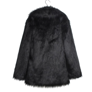 Detail of premium black faux fur coat showing thick plush texture and metal hook closure