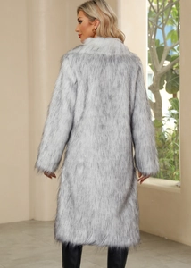 Rear view of a long faux fur coat with white-grey long pile and wide collar for winter