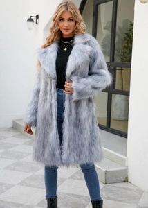 Close-up of a light blue faux fox fur coat featuring an elegant wide notch lapel design