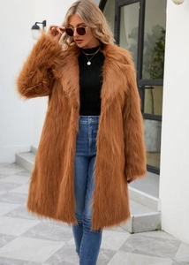 Close-up of fluffy faux fox fur texture on a brown mid-length coat with lapel collar