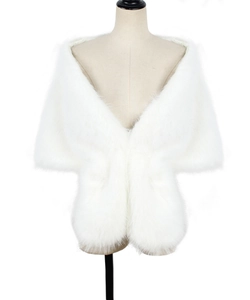 Close-up detail of soft white faux rabbit fur shrug for bridal wedding dresses