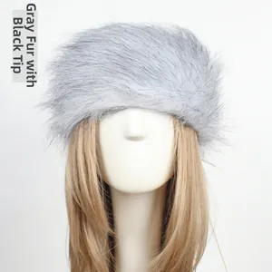Detail of grey faux fur headband with black tips on model for winter warmth