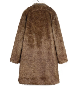 Detailed texture of brown faux fox fur on long winter coat with wide lapels