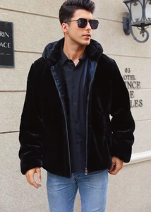 Detail of premium black faux fur texture on men's hooded jacket with a metal zipper