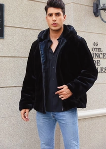 Detail of premium black faux fur hooded jacket with zip closure and plush texture