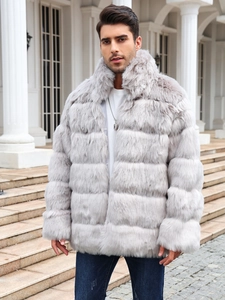 Detailed texture of men's luxury faux fur coat featuring layered grey plush panels