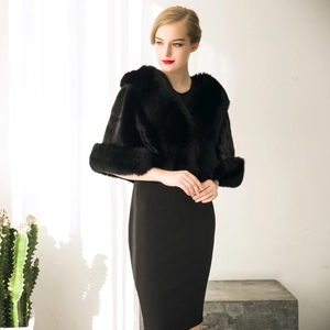 Detailed view of luxurious black faux fur shawl with thick texture and elegant finish