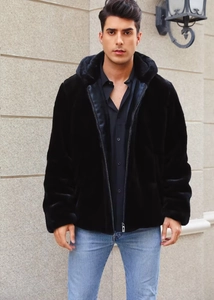 Close-up of premium black faux fur texture on men's hooded jacket with silver zipper detail
