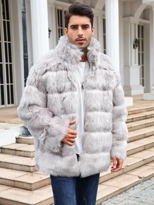 Detail of grey faux fur coat featuring horizontal tiered stitching and a stand collar
