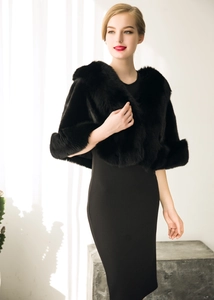 Detailed view of elegant black faux fox fur shawl with thick texture and natural glossy finish