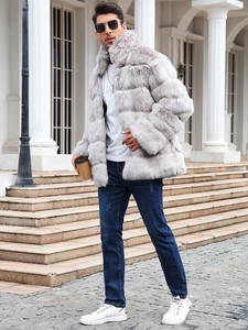 Outdoor shot of men's grey faux fur coat featuring a thick stand collar and layered design