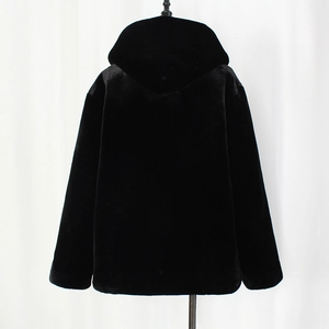 Detailed close-up of premium black faux fur texture on men's winter hooded jacket
