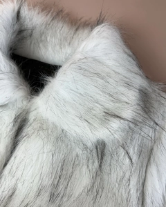 Detailed close-up of soft faux fur texture in cream with grey guard hairs for warm coats