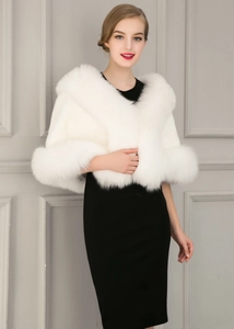Detailed view of plush white faux fox fur shawl wrap for elegant wedding dresses