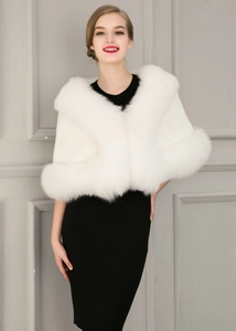Close-up of a white faux fox fur bridal shawl with dense texture and soft silk-like finish