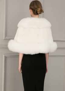 Close-up of white faux fox fur shawl showing premium fluffy texture and thick collar
