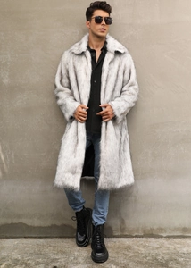 Detailed texture of grey faux fur coat with oversized lapels on stylish model