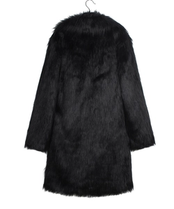 Close-up detail of plush black faux fur texture on long sleeve winter coat