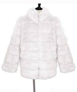 Detailed view of white faux fur coat featuring horizontal striped patterns and stand collar