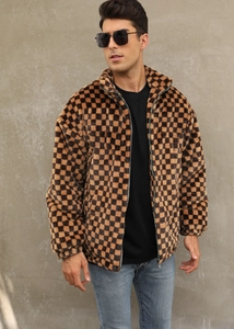 Detailed texture of men's faux fur jacket featuring brown and black checkerboard pattern