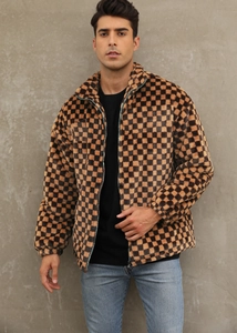 Detailed macro view of the brown and black checkered faux fur jacket with stand collar