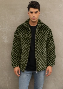 Detail of dark green and black checkerboard faux fur jacket with a sleek stand collar