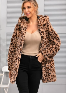 Detail of soft leopard print faux fur texture and hooded design on women's winter coat