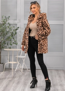 Full body shot of leopard print faux fur hooded jacket with stylish black ankle boots