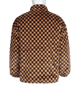 Macro view of the brown and coffee checkerboard faux fur jacket with elastic cuffs