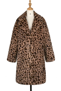 Close-up detail of soft faux fur texture on a notch lapel leopard print winter coat