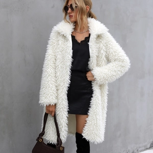Close-up of white faux fur long coat with fluffy texture and stylish lapel collar