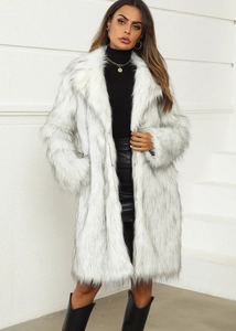 Detailed close-up showing the soft texture of white long faux fox fur with black tips