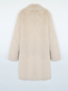 Detailed texture of milk tea colored faux fox fur coat with soft plush finish