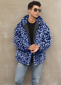 Detail of blue leopard print faux fur jacket showing the zipper and quilted inner lining
