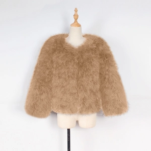 Detail of camel faux fur jacket showing fluffy ostrich feather texture and crew neckline