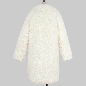 Detail view of white long teddy coat featuring plush faux fur texture and warm long sleeves