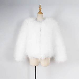 Detailed view of the fluffy white faux fur texture on this collarless winter coat for kids