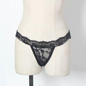 Close-up of black lace G-string showing intricate floral patterns and sheer texture
