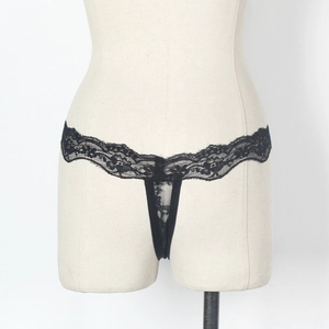 Detailed view of the delicate black floral lace texture on women's sexy thong panties