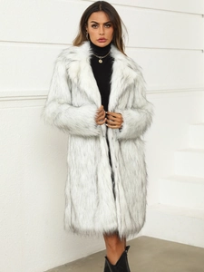 Long faux fox fur coat in white with black tips, featuring a stylish oversized collar